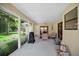 Relaxing screened porch with comfortable seating, ceiling fan, and an outdoor grill at 2342 Audley St, Oviedo, FL 32765