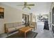 Relaxing screened porch with comfortable seating, ceiling fan, and an outdoor grill at 2342 Audley St, Oviedo, FL 32765