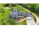 Aerial view of a beautiful home with a screened-in pool and lush landscaping at 23647 Seneca Ridge Ct, Christmas, FL 32709