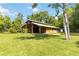 Open-air barn with ample space, perfect for storage or livestock shelter at 23647 Seneca Ridge Ct, Christmas, FL 32709