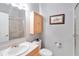 Bathroom featuring a light vanity, framed mirror, and a glass-enclosed shower at 23647 Seneca Ridge Ct, Christmas, FL 32709