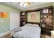 Bedroom with bed, rug, and built-in shelving at 23647 Seneca Ridge Ct, Christmas, FL 32709