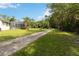 Long driveway and mature landscaping lead to this peaceful home and backyard oasis at 23647 Seneca Ridge Ct, Christmas, FL 32709