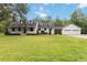 Inviting single-Gathering home with well-manicured lawn and a charming front porch at 23647 Seneca Ridge Ct, Christmas, FL 32709