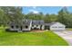 Charming two-story home with a well-manicured lawn and a three-car garage at 23647 Seneca Ridge Ct, Christmas, FL 32709