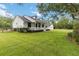 Beautiful home featuring a inviting front porch and a well-manicured front yard at 23647 Seneca Ridge Ct, Christmas, FL 32709