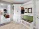 Hallway with built-in bench seating, storage, and wine rack by entryway at 23647 Seneca Ridge Ct, Christmas, FL 32709