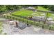 Aerial view of horse arena with horses near wooden fence at 23647 Seneca Ridge Ct, Christmas, FL 32709