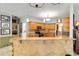Open kitchen featuring a breakfast bar with granite countertops and pendant lighting at 23647 Seneca Ridge Ct, Christmas, FL 32709