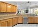 Updated kitchen features stainless appliances, tile backsplash, granite countertops, and ample cabinet space at 23647 Seneca Ridge Ct, Christmas, FL 32709