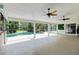 Enclosed lanai with ceiling fans overlooking the inviting swimming pool at 23647 Seneca Ridge Ct, Christmas, FL 32709