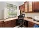 Bright office space with custom cabinetry, a large window, and natural light at 23647 Seneca Ridge Ct, Christmas, FL 32709
