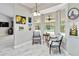 Cozy sitting area with views of the pool, bright interior and decorated with colorful artwork at 23647 Seneca Ridge Ct, Christmas, FL 32709