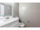 Bathroom features a modern sink, vanity, and illuminated mirror at 2627 Oak Park Way # 102, Orlando, FL 32822