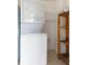 Laundry area with stackable washer/dryer and shelving at 2627 Oak Park Way # 102, Orlando, FL 32822
