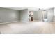 Open-concept living room with tile flooring, a ceiling fan, and a view of the kitchen at 2627 Oak Park Way # 102, Orlando, FL 32822