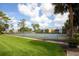 Community tennis courts surrounded by lush landscaping at 2627 Oak Park Way # 102, Orlando, FL 32822