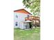 Well-maintained backyard with an upper deck, shed, grilling area, and lush green lawn at 312 W Hull Ave, Oakland, FL 34760
