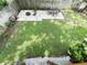 Expansive backyard features a lush lawn and tiled patio perfect for entertaining at 312 W Hull Ave, Oakland, FL 34760
