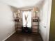 Bright bedroom featuring wood floors, natural light, and stylish shelving units at 312 W Hull Ave, Oakland, FL 34760