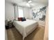 Bedroom featuring neutral tones, soft lighting, and stylish décor at 312 W Hull Ave, Oakland, FL 34760