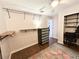 Spacious closet with shelving and dresser offering practical storage solutions at 312 W Hull Ave, Oakland, FL 34760
