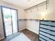 Bright closet with sliding glass door, shelving and dresser storage at 312 W Hull Ave, Oakland, FL 34760