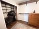 Organized closet with shelves and a dresser, suitable for office or storage at 312 W Hull Ave, Oakland, FL 34760