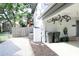 Exterior view showing the garage with bicycle storage and access to the backyard at 312 W Hull Ave, Oakland, FL 34760