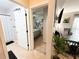 Hallway with a view into the bathroom, the bedroom, and the dining area at 312 W Hull Ave, Oakland, FL 34760
