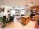 Kitchen with stainless steel appliances, granite countertops, and an adjacent dining area at 312 W Hull Ave, Oakland, FL 34760