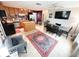 Eat-in kitchen with stainless steel appliances, an island, and an adjacent dining area at 312 W Hull Ave, Oakland, FL 34760