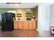 Cozy kitchenette with granite countertops, modern appliances, and functional storage at 312 W Hull Ave, Oakland, FL 34760