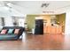 Bright living area with hardwood floors, modern appliances, and a welcoming atmosphere at 312 W Hull Ave, Oakland, FL 34760