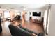 Expansive living room with hardwood floors, comfortable seating, and a large entertainment area at 312 W Hull Ave, Oakland, FL 34760