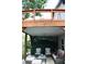 Under-deck patio area with comfortable seating and privacy lattice at 312 W Hull Ave, Oakland, FL 34760