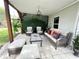 Cozy patio area with stylish furniture, perfect for outdoor lounging and relaxation at 312 W Hull Ave, Oakland, FL 34760