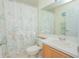 Functional bathroom with a toilet, vanity, sink, and a shower/tub at 3231 Furlong Way, Gotha, FL 34734