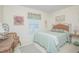Charming bedroom with a cozy bed, complemented by floral accents and natural light at 3231 Furlong Way, Gotha, FL 34734