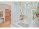 Welcoming foyer boasts tile floors, staircase, and natural light streaming in from high windows at 3231 Furlong Way, Gotha, FL 34734
