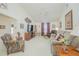 Spacious living room featuring vaulted ceilings, neutral paint, comfortable seating, and natural light at 3231 Furlong Way, Gotha, FL 34734