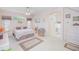 Spacious main bedroom with a decorative bed and ensuite bath, creating a private retreat at 3231 Furlong Way, Gotha, FL 34734