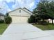 Charming single-story home with a well-maintained lawn and a two-car garage, perfect for Gathering living at 324 Charles Dr, Deland, FL 32724