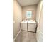 This tidy laundry room is equipped with a washer and dryer, and natural light at 324 Charles Dr, Deland, FL 32724