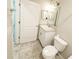 Well-lit bathroom featuring a vanity with a sink, mirror, and a toilet at 3381 Sw 129Th Loop, Ocala, FL 34473