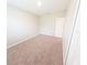 Bedroom with neutral carpet, a window and a white door at 3381 Sw 129Th Loop, Ocala, FL 34473