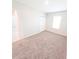 Bedroom with neutral carpet, a closet, and a window providing natural light at 3381 Sw 129Th Loop, Ocala, FL 34473
