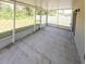 Screened in porch provides additional outdoor living space and overlooks a yard at 3381 Sw 129Th Loop, Ocala, FL 34473