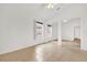 Open bedroom featuring two windows, tile flooring, and ample closet space at 3390 Cypress Point Cir, St Cloud, FL 34772