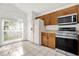 Bright kitchen with stainless steel appliances and tile flooring at 3390 Cypress Point Cir, St Cloud, FL 34772